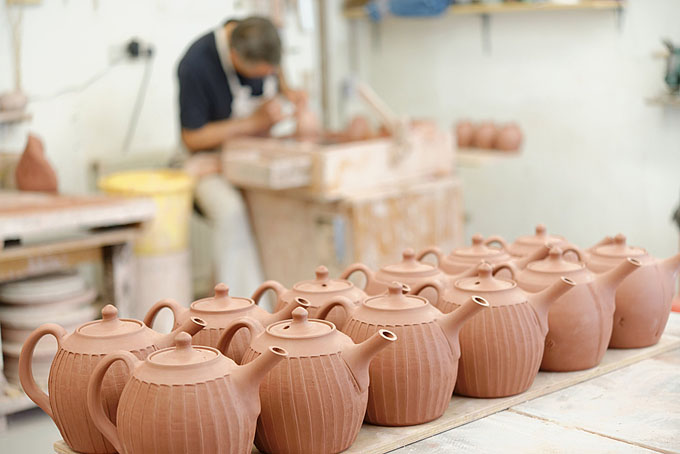 John and Jude Jelfs working together in their pottery in Bourton on the Water