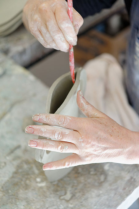 John and Jude Jelfs working together in their pottery in Bourton on the Water