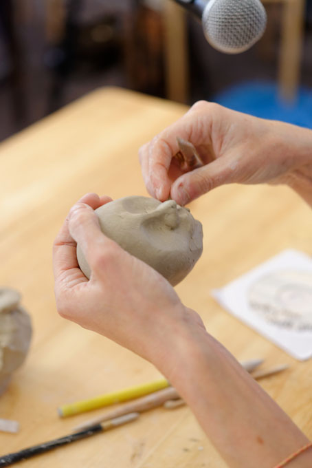 Sally MacDonell demonstrating the building of a face at Oxford Ceramics Fair 2013