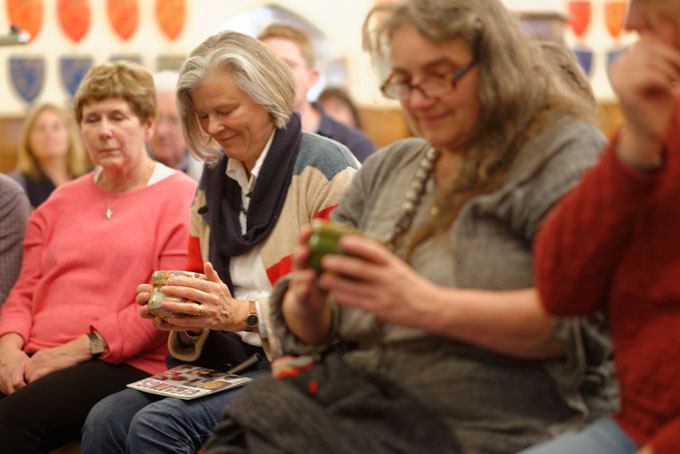 Lisa Hammond finishing bowls during a demonstration at Oxford Ceramics Fair 2013. The bowls were not turned but carved with a wooden blade
