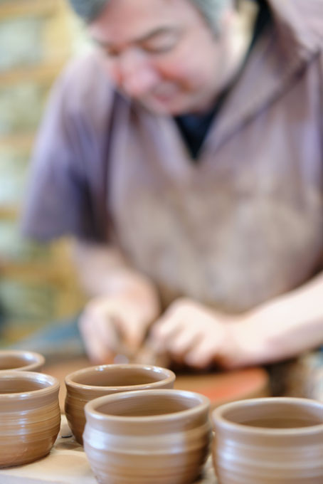 Paul Jessop at Barrington Pottery 2014 making small sauce pots